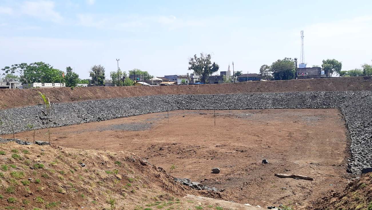 Rainwater harvesting reservoir at an Adani Energy Solutions site